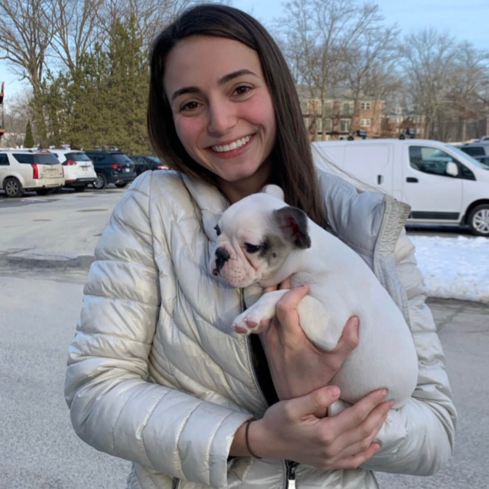 Happy family with their French Bulldog puppy