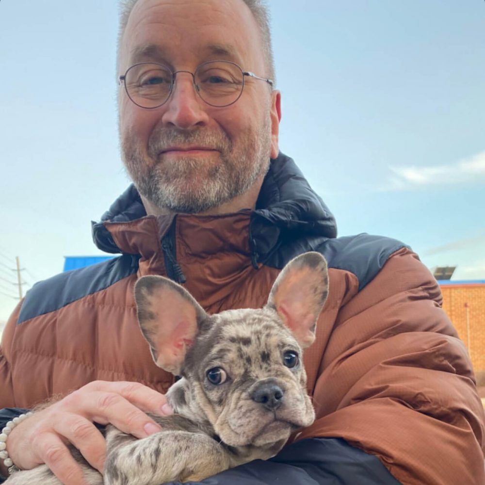 French Bulldog puppy with its new owners